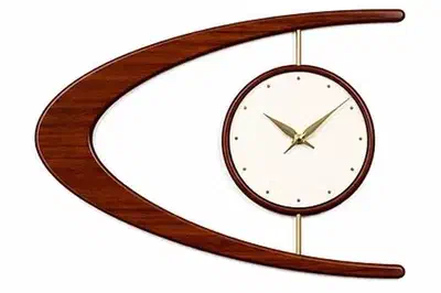 A midcentury modern style wooden wall clock.