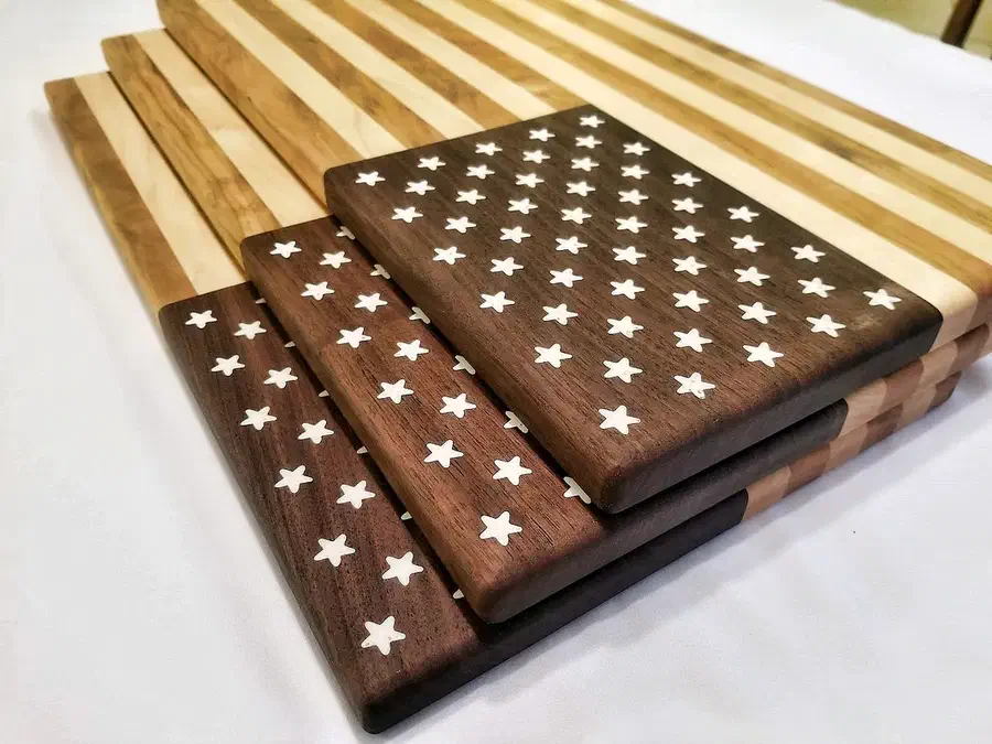 Stacked dark wood star fields beside striped maple flag panels