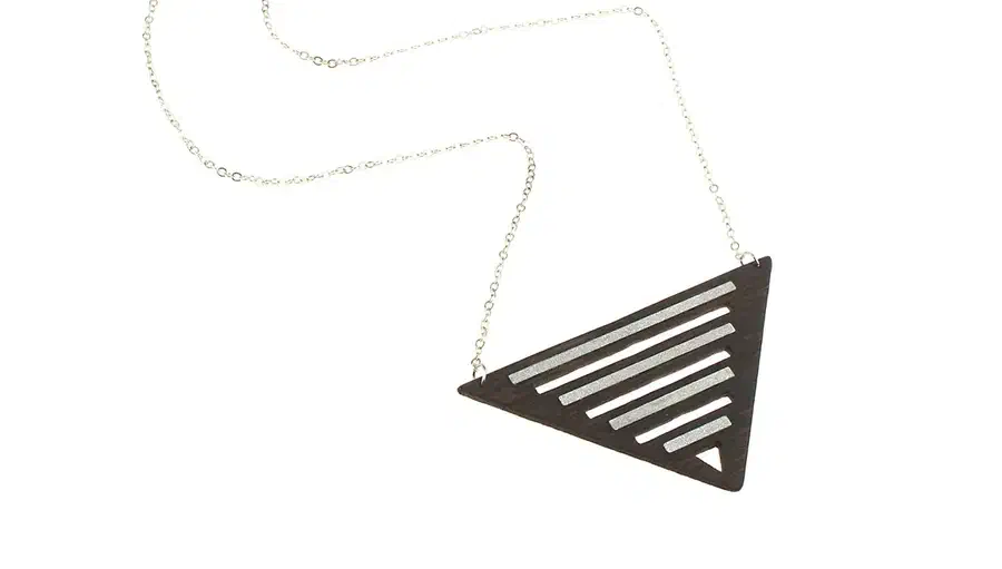 A dark triangular wooden necklace with parallel silver-colored aluminum inlays and a fine metal chain