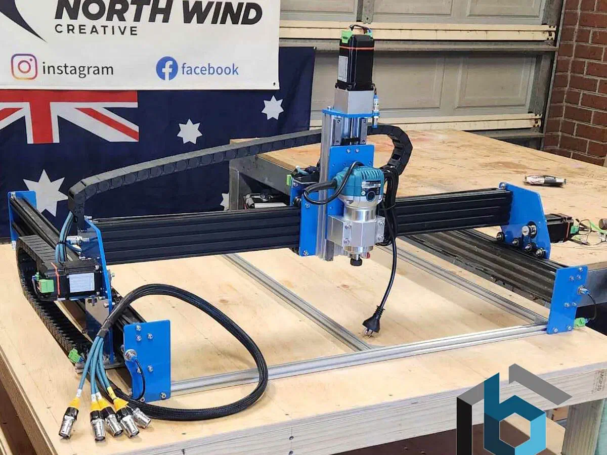 A BlueCarve Bluey v2 CNC router with an Australian flag behind it.