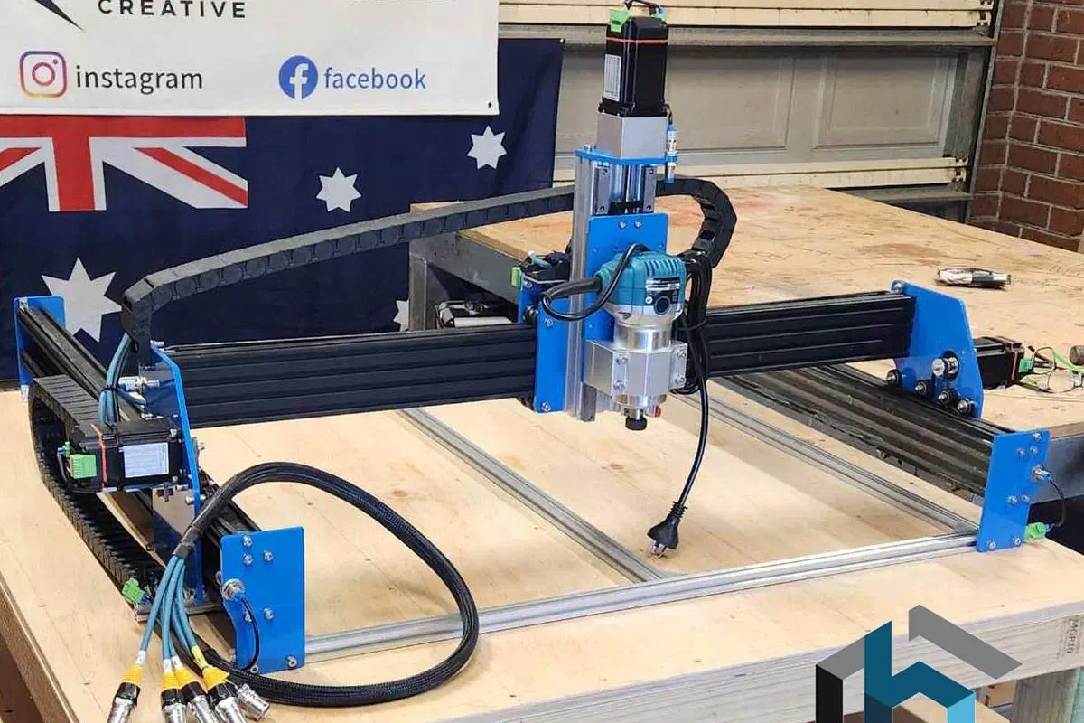 A BlueCarve Bluey v2 CNC router with an Australian flag behind it.